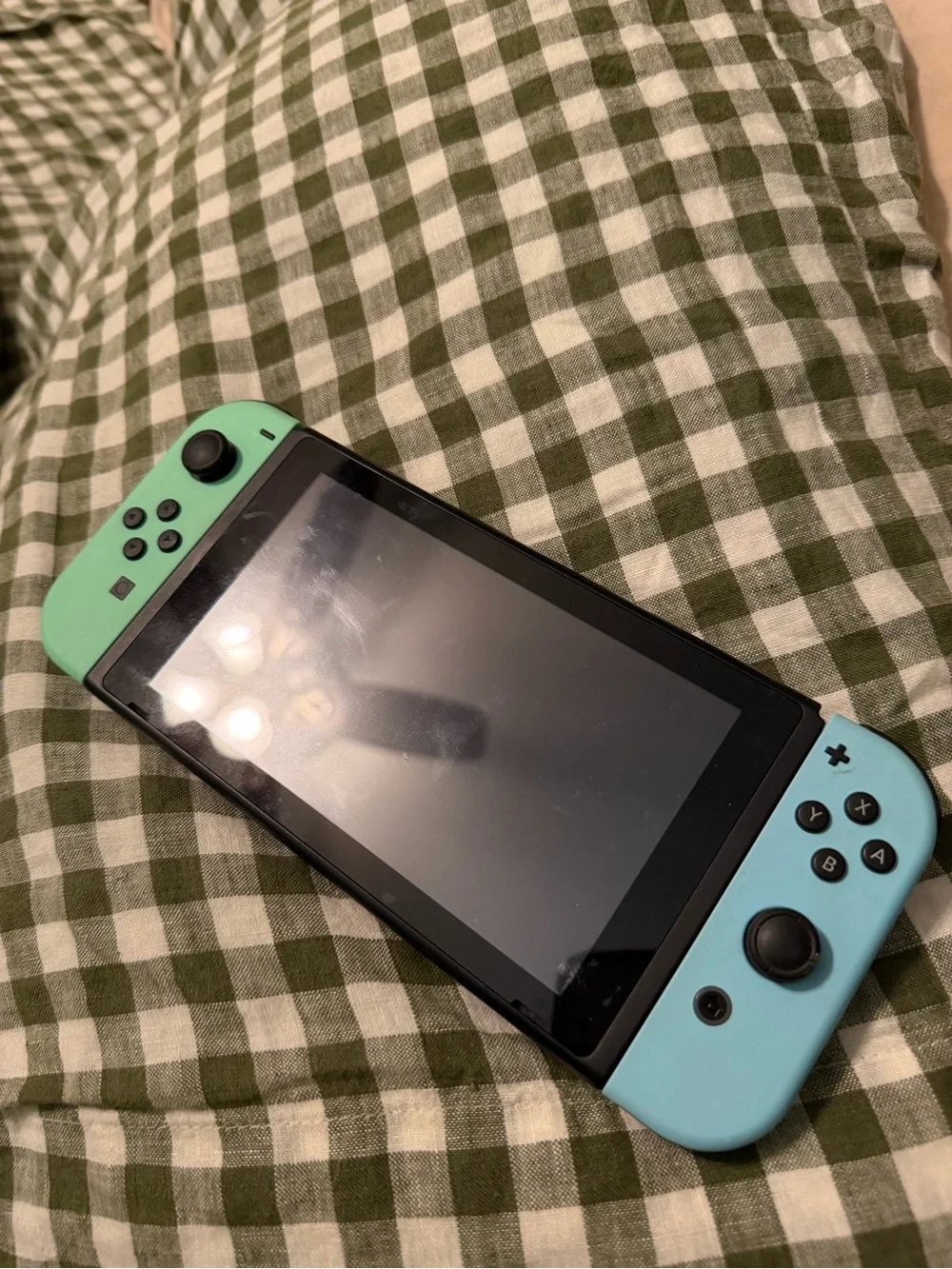 Nintendo Console with Mint & Teal Joy-Con Controllers
